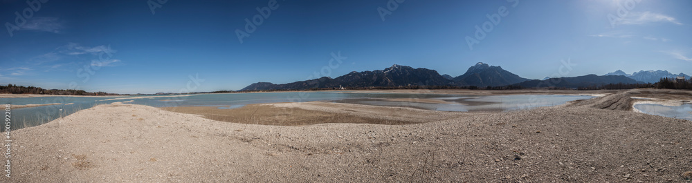 Panorama of lake Forggensee, water reservoir without water, near Fussen in Bavaria, Germany Panorama of lake Forggensee, water reservoir without water, near Fussen in Bavaria, Germany