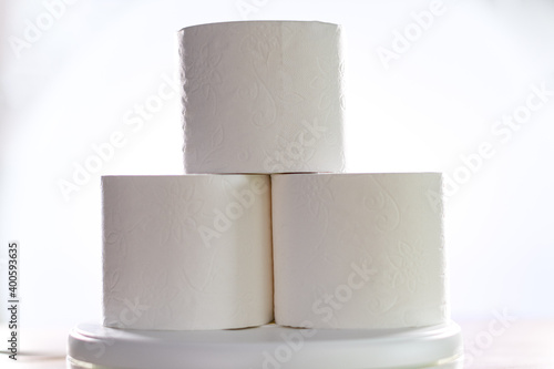Three rolls of toilet paper so requested in the pandemic, front photo and white background