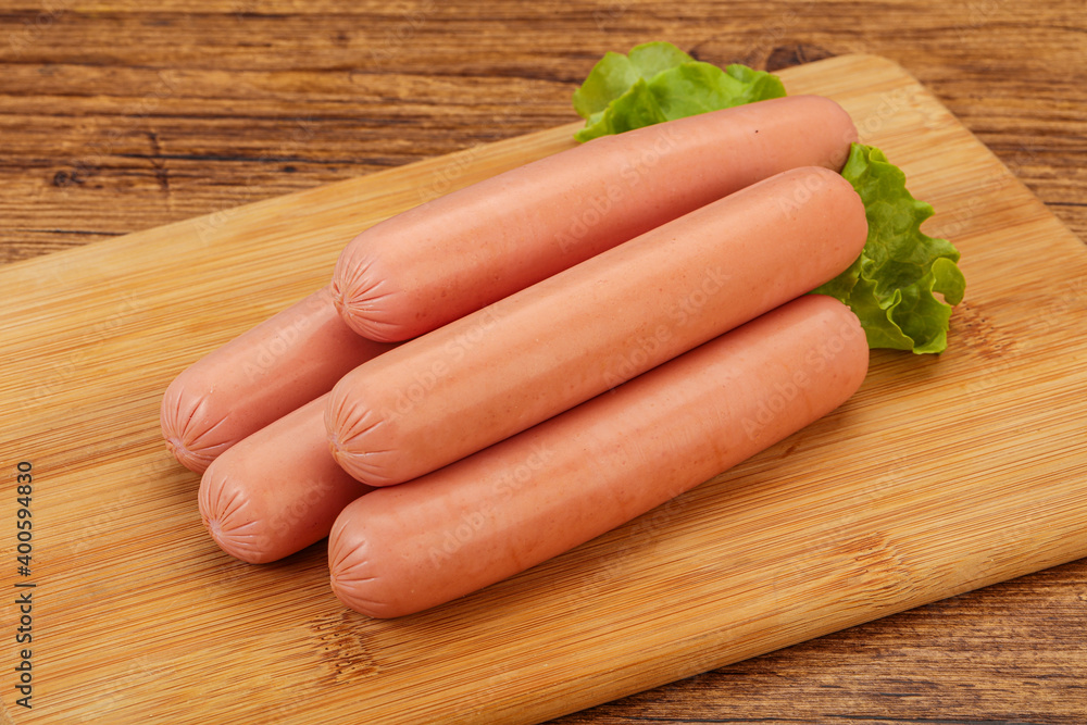 Tasty meat sausages over board Tasty meat sausages over board