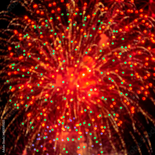 Fireworks light up at New Year Eve. Abstract Festive background with fireworks sparkles. Copyspace.