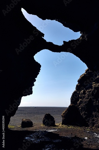 Cave entrance in Iceland, Hjorleifshofdi photo