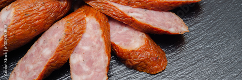 Obraz na plátne Traditional Polish sausage cut into slices, typical delicatessen product from Ea