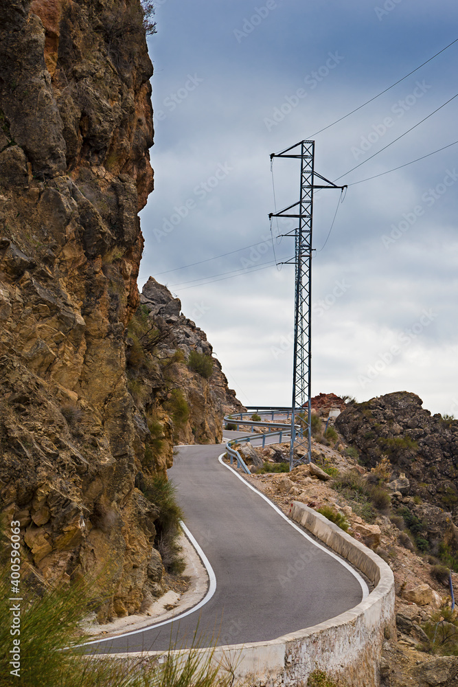 winding road and electricity antenna