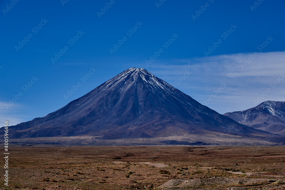 Licancabur is a black stratovolcano on the border between Bolivia and Chile in the high altitude of the altiplano n the andes mountains, South America