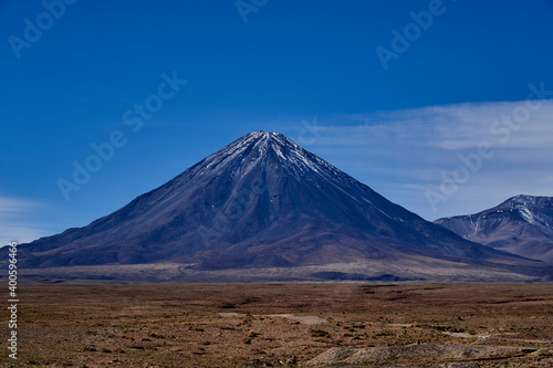Licancabur is a black stratovolcano on the border between Bolivia and Chile in the high altitude of the altiplano n the andes mountains, South America