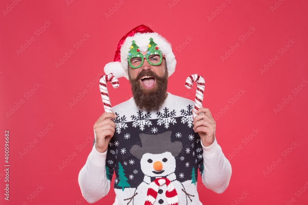 cheerful party goer in santa hat and knitted sweater feel joy and prepare for christmas celebration, christmas fun