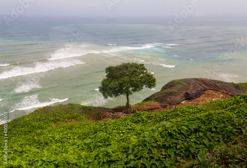 The Pacific Ocean coastline of Miraflores, Lima, Peru, seen from high above the cliffs, is a popular tourist attraction and desitination for surfing and paragliding. photo