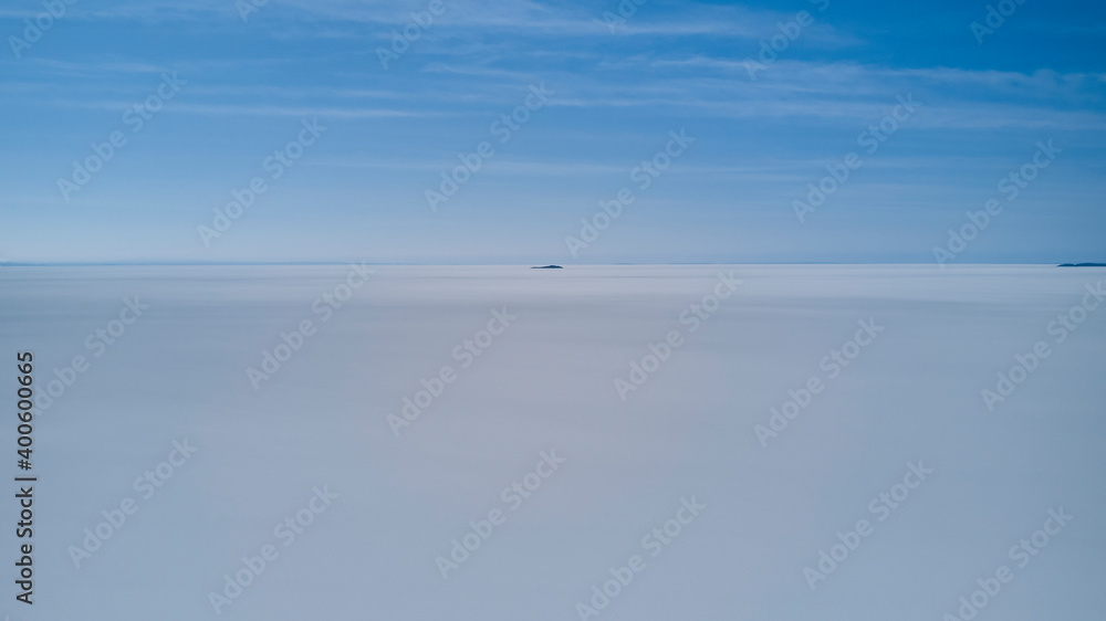 Aerial of Salar de Uyuni, Salar de Tunupa, worlds largest salt flat, in the altiplano of Bolivia in the andes mountains. Worlds biggest lithium source and popular travel destination in South America