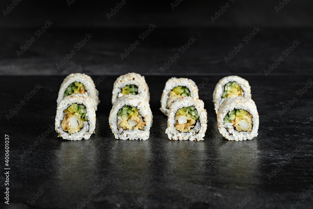 Sushi Rolls. Sushi Rolls Set, maki, philadelphia and california rolls, on a Black background. Sushi Rolls. Sushi Rolls Set, maki, philadelphia and california rolls, on a Black background.