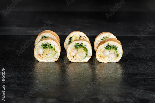 Sushi Rolls. Sushi Rolls Set, maki, philadelphia and california rolls, on a Black background.