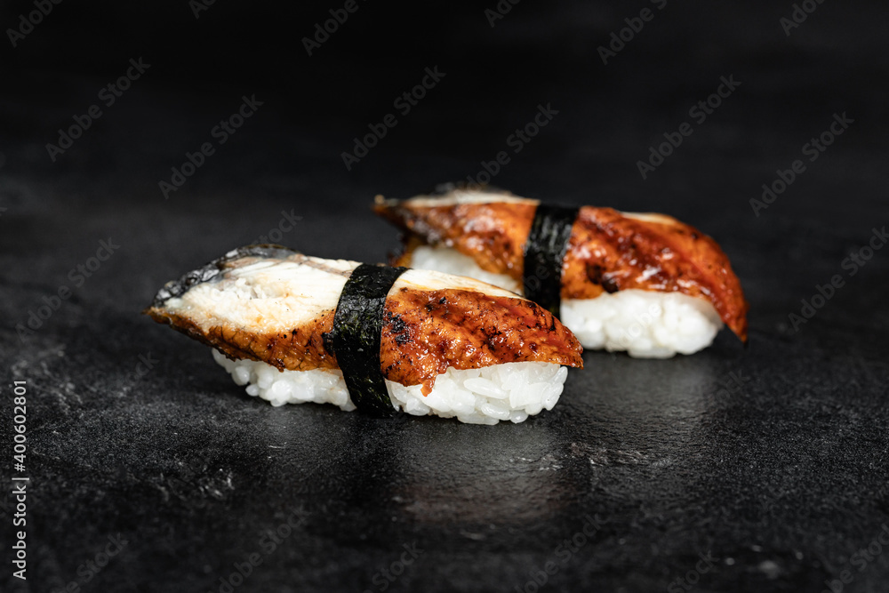 Sushi Rolls. Sushi Rolls Set, maki, philadelphia and california rolls, on a Black background. Sushi Rolls. Sushi Rolls Set, maki, philadelphia and california rolls, on a Black background.