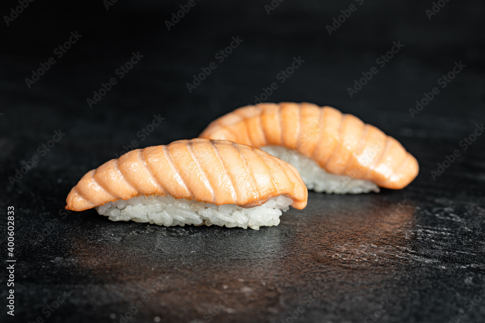 Sushi Rolls. Sushi Rolls Set, maki, philadelphia and california rolls, on a Black background. Sushi Rolls. Sushi Rolls Set, maki, philadelphia and california rolls, on a Black background.