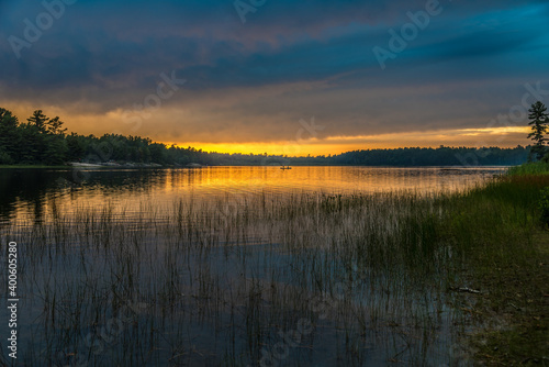 Fototapeta Naklejka Na Ścianę i Meble -  Sunset above forest lake