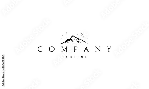 Vector logo on which an abstract image of a mountain peak on a background of the starry sky.