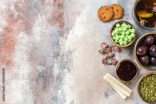 Wallpaper Mural top view cup of tea with fruits on light background sweet dessert biscuit Torontodigital.ca