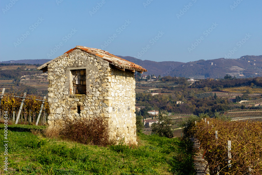 Ruins of an ancient building near the town of Marano di Valpolicella. A small town with many buildings of medieval origin.