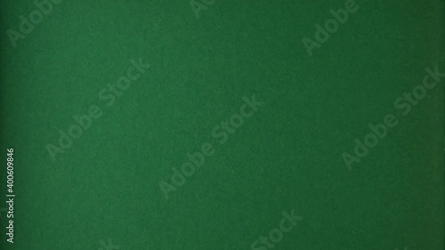 Red paper is torn over green background for message, stop motion, animation. Template for your text.