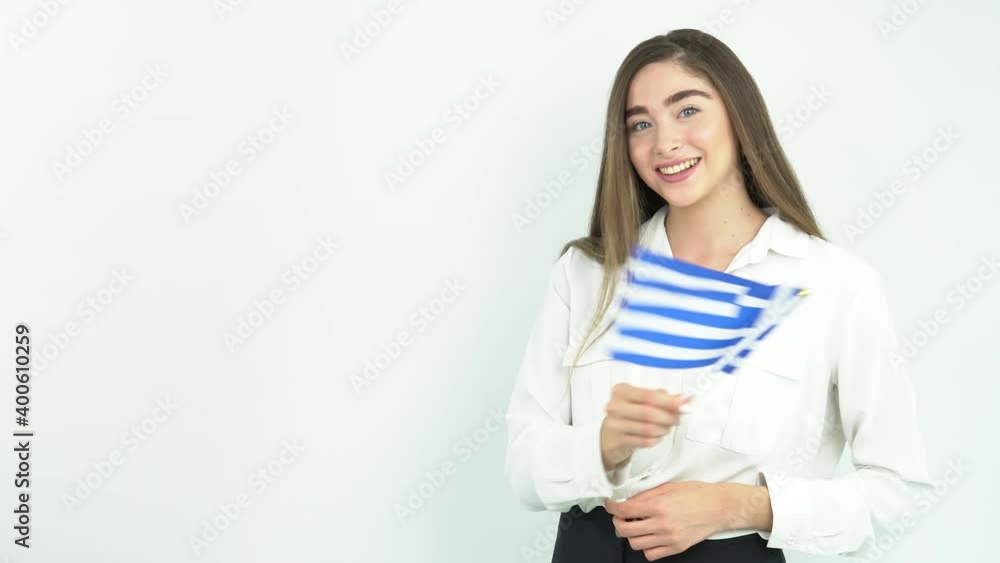 blonde woman waving greece flag in front of white background blonde woman waving greece flag in front of white background
