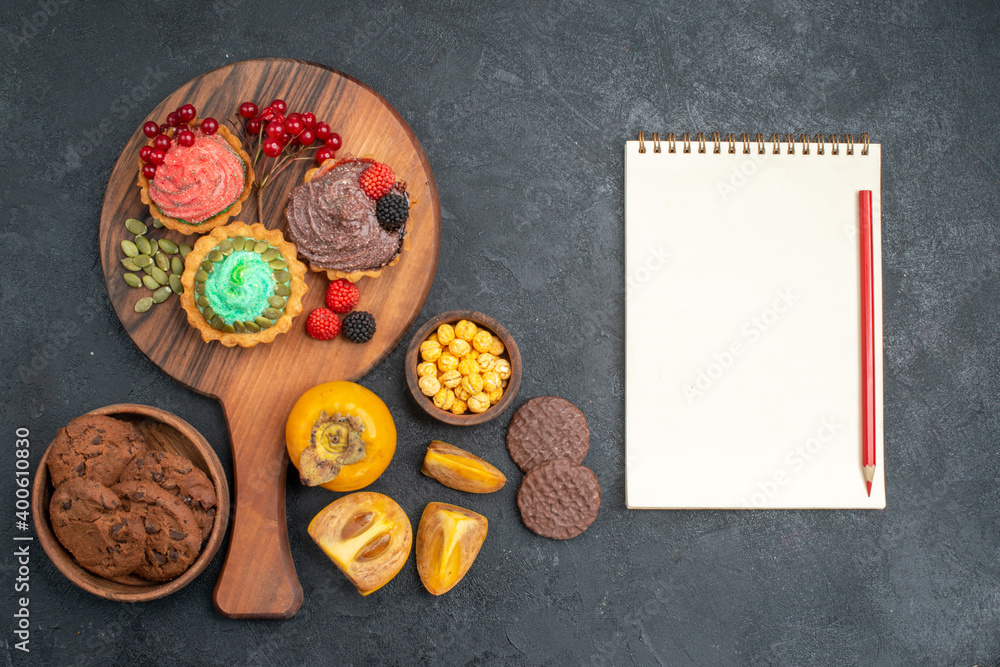 top view delicious cakes with biscuits and fruits on dark background sweet pie cake top view delicious cakes with biscuits and fruits on dark background sweet pie cake