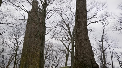 Large stone tower in winter from ground level photo