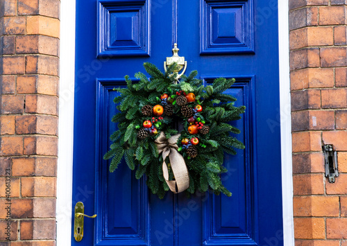 Traditonal Christmas wreath on a blue door