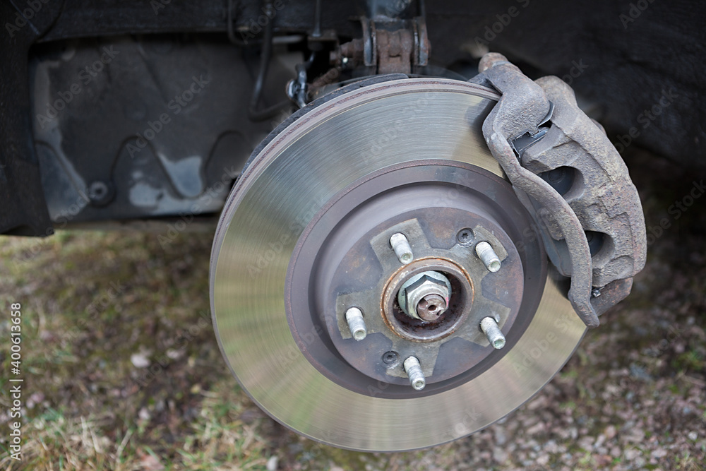 Front disc brake of the vehicle for repair, in process of new tire replacement or alloy hub change