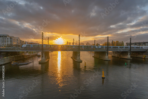 Gennevilliers, France - 27 11 2020: View of the Seine and The Defense district at sunset from Asnieres bridge
