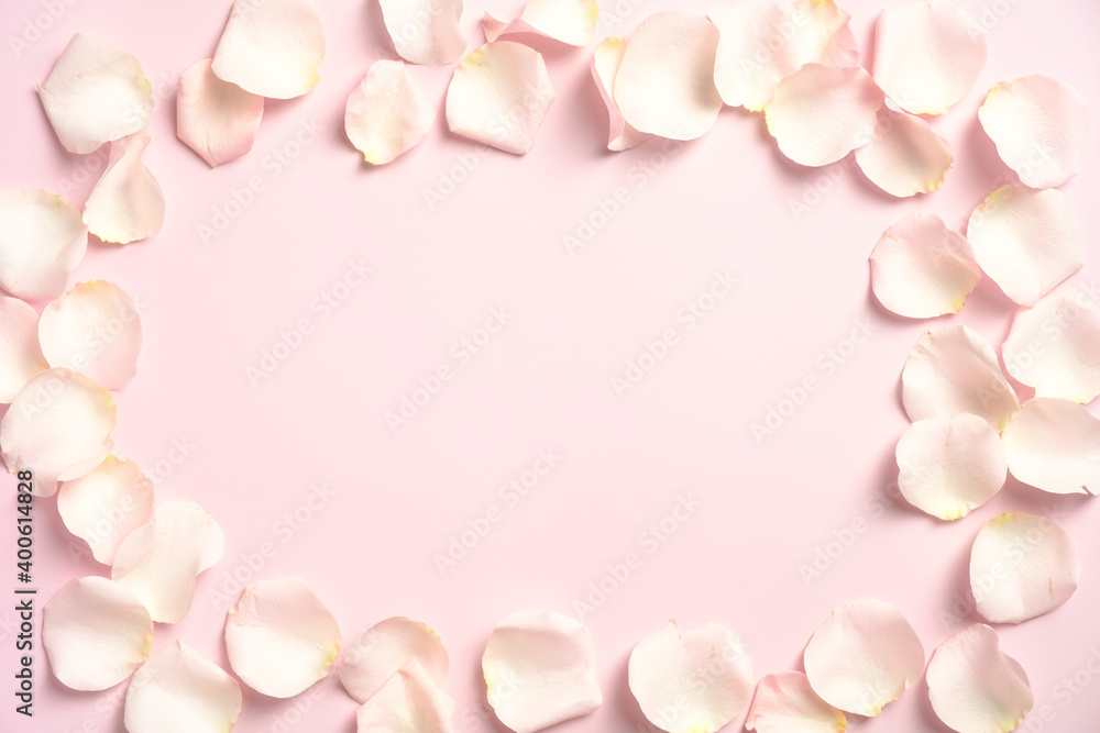 Frame border made of rose petals on pastel pink background. Happy Valentines Day greeting card mockup, banner design. Top view with copy space, flat lay.