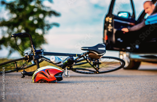 Traffic accident between bicycle and a car photo