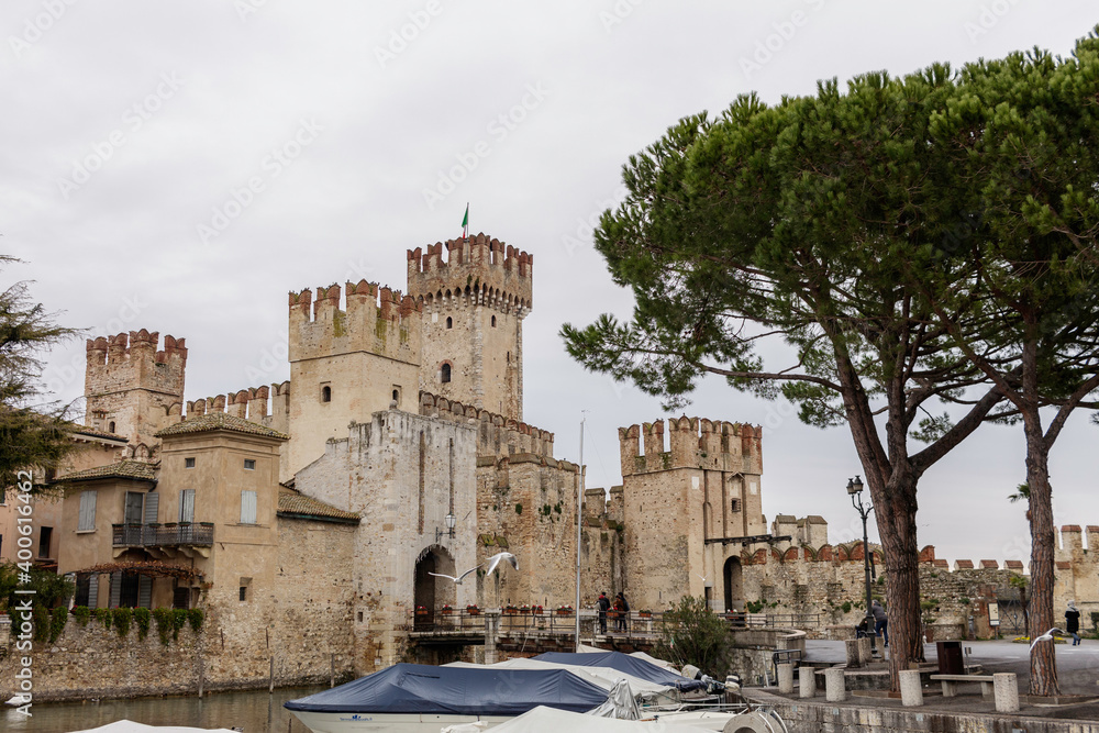 Fototapeta premium The Scaligero castle of Sirmione is a fortress from the Scaligera era, the access point to the historic center of Sirmione. It is one of the most complete and best preserved castles in Italy.