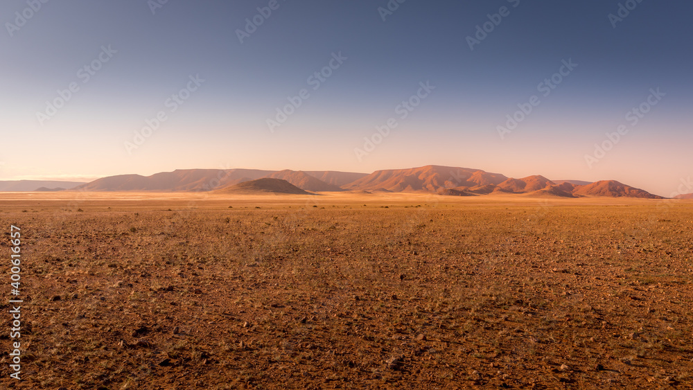 Beautiful and colorful mountains of Namibia at sunset.