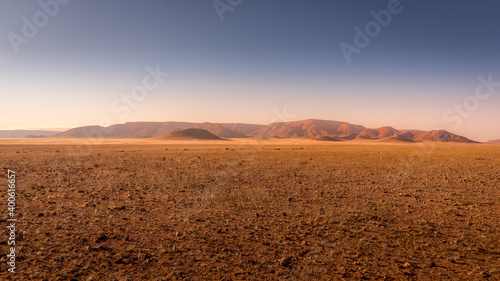 Photos Beautiful and colorful mountains of Namibia at sunset.