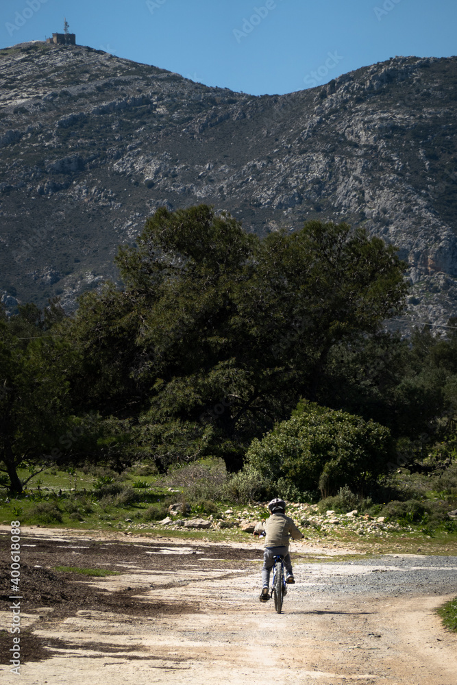 Fototapeta premium Boy riding bicycle on road