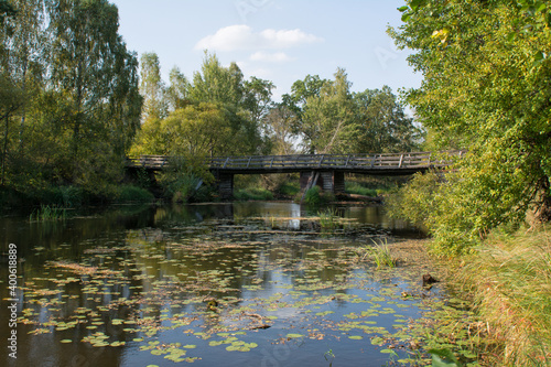 Wooden bridge over the river in summer day