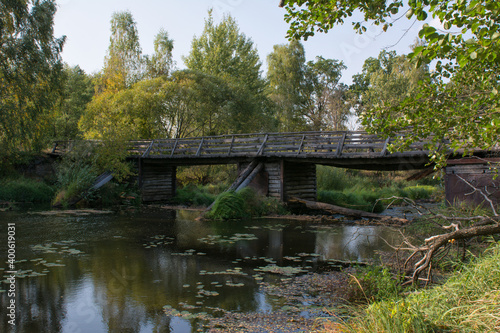 Wooden bridge over the river in summer day