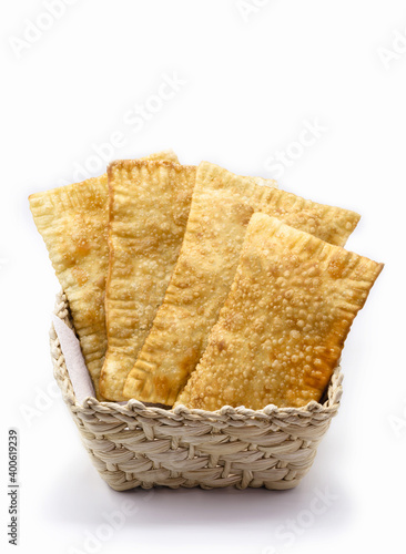 Brazilian pastry, traditional pasta called meat pastry on isolated on white background, copyspace