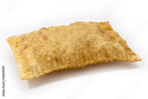 Brazilian pastry, fried dough and stuffed with meat, cheese or shredded chicken. Salty typical of fairs and markets on isolated white background.