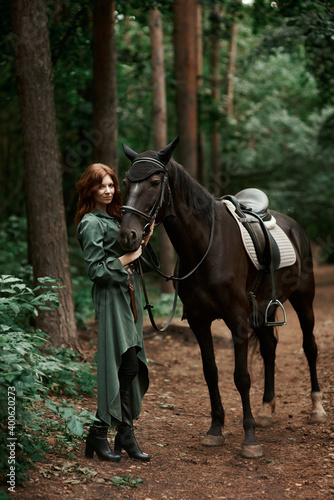 Gourmet lady in a vintage dress. A beautiful rider gently hugs the horse. Artistic Photography © Владимир Николаев