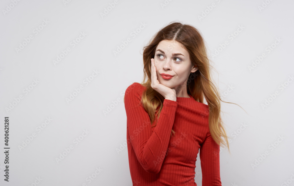 Woman in red dress gestures with hands emotions studio isolated background Woman in red dress gestures with hands emotions studio isolated background