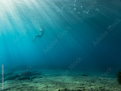 Boy swimming in ocean