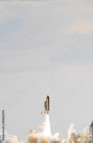 Fototapeta Naklejka Na Ścianę i Meble -  Rocket spaceship. Blue skies. The elements of this image furnished by NASA.
