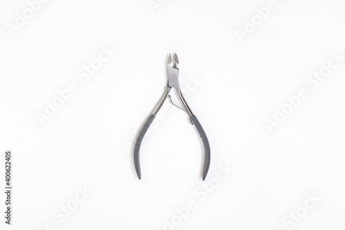 Professional brushwork cuticle nippers on white background. photo