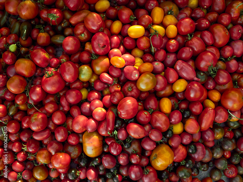 Background with ripe red tomatoes..