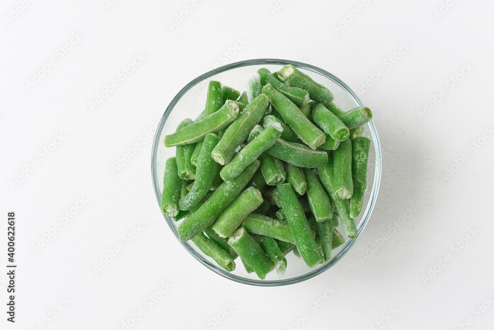 Glass plate with frozen green bean slices. Diet and maintain weight by taking healthy foods. Glass plate with frozen green bean slices. Diet and maintain weight by taking healthy foods.
