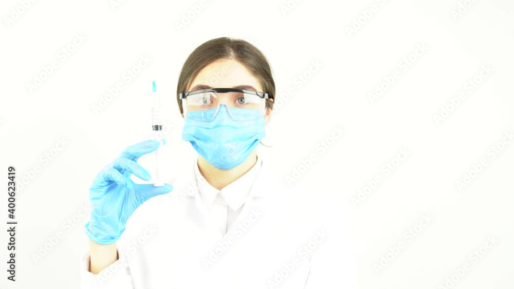 covid-19 corona virus, doctor or scientist in laboratory holding a syringe 