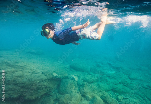 Young boy snorkeling underwater