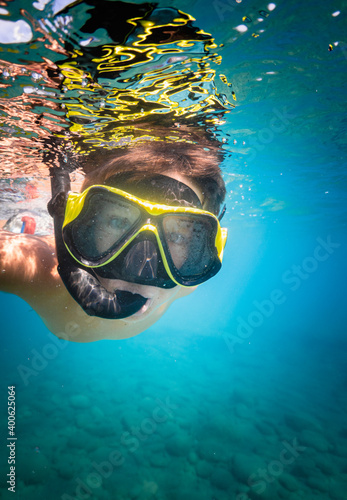 Young boy snorkeling underwater