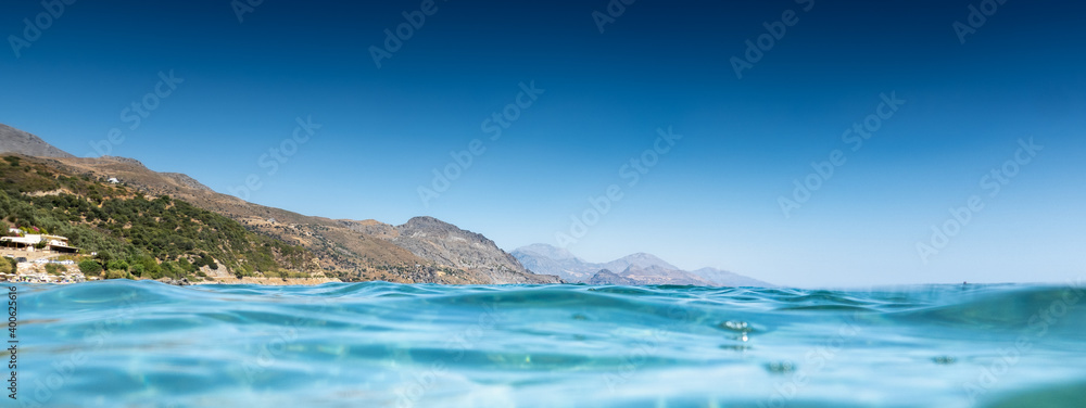 Fototapeta premium Blue sea with mountains