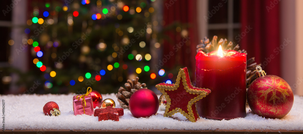 Christmas red candle with decorations and fir tree isolated on lights background. - obrazy, fototapety, plakaty 