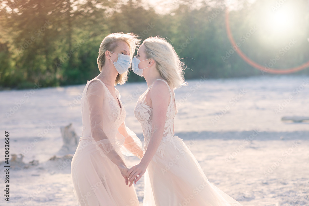 Lesbian couple wedding, wear masks to prevent epidemic COVID-19 Lesbian couple wedding, wear masks to prevent epidemic COVID-19
